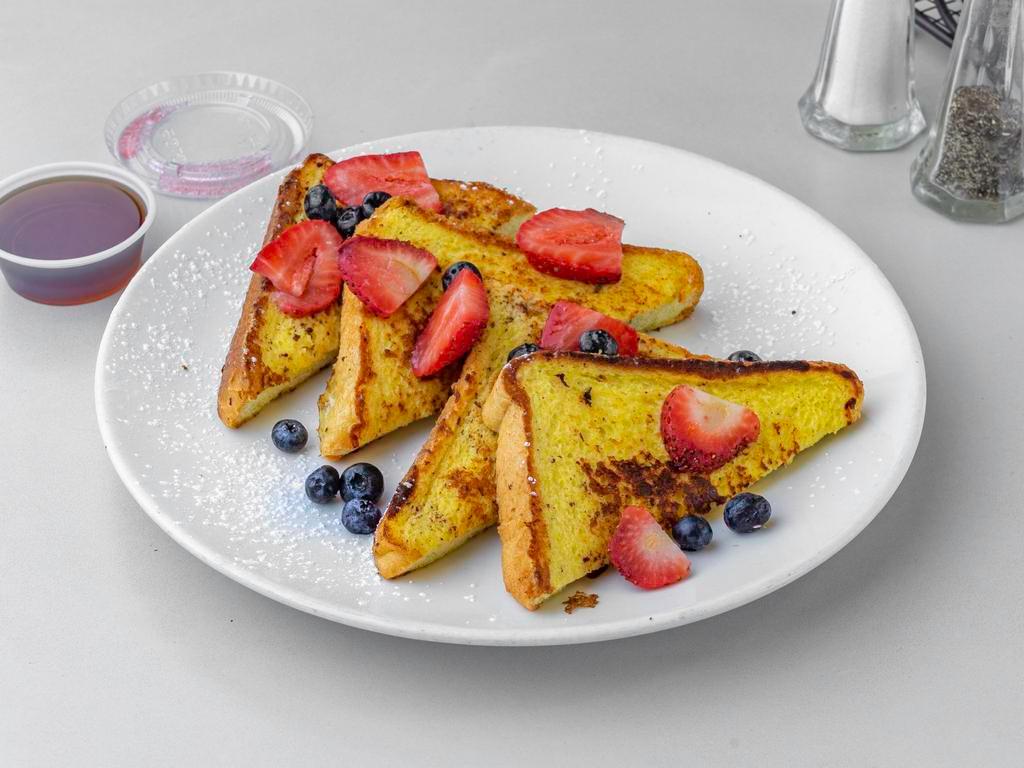 Brioche French Toast Breakfast · Fresh fruits, maple syrup, side of butter.