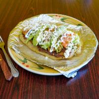 Huaraches de lengua  · Corn tortilla, beef tongue, lettuce, tomato, avacado, cheese, and sour cream.