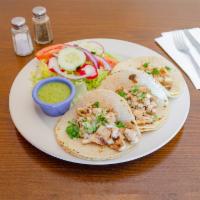 6. Tacos de Pollo · Shell tacos with chicken.