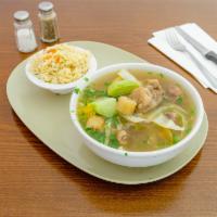 1. Sopa de Res · Con yuca, platano madura, banano verde, repollo y elote. Beef soup with cassava, sweet plant...