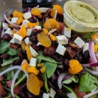 Eliza Salad · Tomato, mandarin oranges, onions, candied walnuts, cranberries, fresh mozzarella over mixed ...