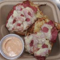 Reuben Hot Sandwich · House roasted NY style corned beef sliced thin. Lightly grilled on top of rye toast with Rus...