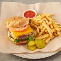 Cheeseburger Deluxe · Served with french fries, lettuce and tomato on a sesame seed bun.