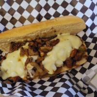 Philly Cheesesteak Sandwich · This sandwich is made from thinly sliced pieces of marinated and seasoned steak and melted p...