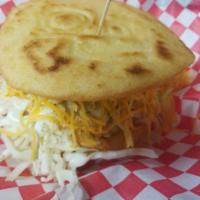 Fried Arepa - Venezuela · Cornmeal gluten free dough fried, tomatoes, coleslaw and our homemade green sauce. With your...
