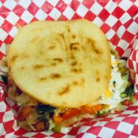Veggie Arepa · Cornmeal gluten free dough, grilled or fried, tomatoes, coleslaw, green and red bell pepper,...