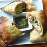 Empanada · Side of house-made salsa verde available upon request!