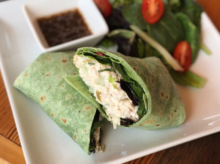 Chicken Salad Wrap · Our house-made chicken salad with mixed greens and pesto, all wrapped in a spinach tortilla. Served with a side salad!
