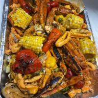 Peter's Grilled Seafood · Shrimps, salmon, fish filet, lobster, calamari, crab legs , clams ,corn  and green plantain 