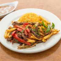 Lomo Salteado · Steak, peppers, onions, french fries and coriander.