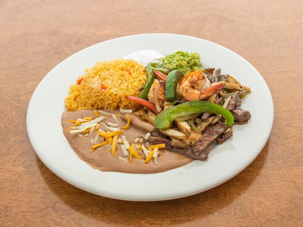 Tex Mex Fajitas · Served with sauteed onions, peppers, rice, beans, guacamole and sour cream with a soft flour tortilla on the side.