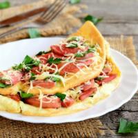 Western Omelette · Juicy ham, locally grown green peppers, onions and free range eggs prepared any style. Serve...