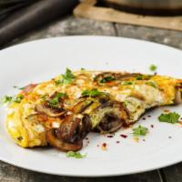 Goat Cheese and Spinach Omelette · Creamy goat cheese, locally grown spinach and mushrooms and free range eggs prepared any sty...