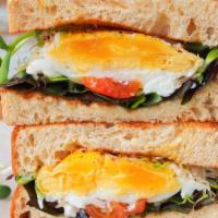 Double Egg and Cheese Sandwich · Free range eggs prepared any style and creamy cheese on a toasted bread of choice.
