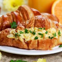 Croissant Sandwich · Free range scrambled eggs, hearty sausage and creamy American cheese on a toasted croissant.