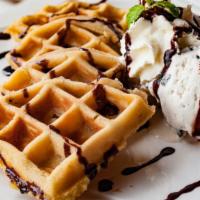 Belgian Waffle · Fresh Belgian waffle served with a side of syrup and butter.