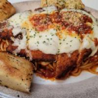 Chicken Parmigiana · Over spaghetti.