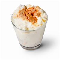 -Banana Pudding · A luscious vanilla pudding layered with bananas and wafer cookies.