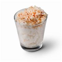 -Coconut Rice Pudding (GF)(V) · Coconut Milk Rice Pudding topped with toasted coconut.