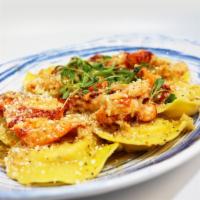 Lobster Ravioli · lobster and cheese stuffed ravioli, sauteed in mojo de ajo sauce, topped with lobster meat a...