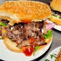 Burger Gyro  · A fresh beef lamb gyro grilled to perfection and placed on a soft, toasted sesame seed bun. ...