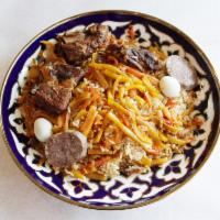 Uzbek Plov · Made with beef, lamb, rice, carrot, raisins and chickpeas.