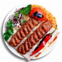 Lamb Adana Kebab · Includes salad and side dish.