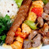 Chicken Shish Kebab · Includes salad and side dish.