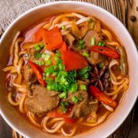 Lagman Soup · Beef and handspun noodles inside a rich and delicious broth with vegetables and Asian spices.