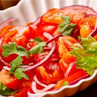 Achik-Chuchuk Salad · Thin sliced tomatoes, onions and jalapenos, seasoned with olive oil, balsamic vinegar and sp...