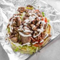 Lamb Gyro Sandwich · Cooked to perfection and wrapped in a pita.