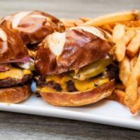 3 Sliders · 3 sliders, beef burger on pretzel bun with cheddar cheese, onions, pickles and chipotle mayo.