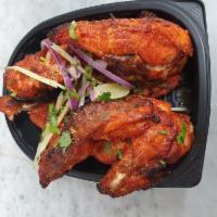 Chicken Chargha · Marinated chicken Lahori style fried.