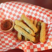 Mozzarella Sticks · 7 Thick mozzarella slices breaded 3 times in house, then fried to a golden crisp. Served wit...