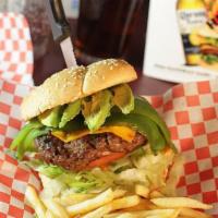 Border Burger · A 6 oz burger topped with American cheese, long green chile, and avocado served with all the...