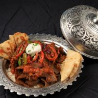 Leskandar Kabob  · Gyro’s meat sautéed in house garlic tomato sauce, served with rice, Greek yogurt, sautéed re...