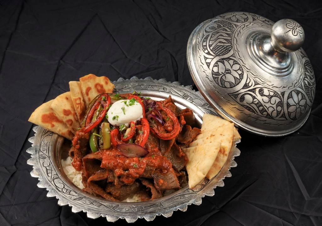 Leskandar Kabob  · Gyro’s meat sautéed in house garlic tomato sauce, served with rice, Greek yogurt, sautéed red and green bell pepper.