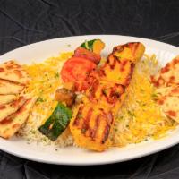 Chicken Shish Kabob · Marinated (saffron) chicken breast, charbroiled and served over steamed basmati rice (garnis...