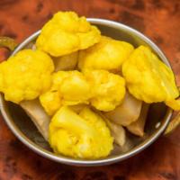 Aloo Gobi · Potato and cauliflower with cumin and spices.