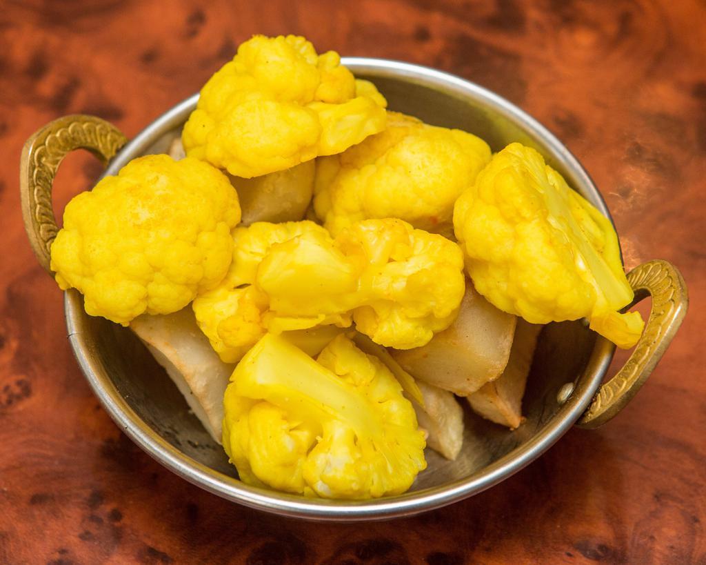 Aloo Gobi · Potato and cauliflower with cumin and spices.