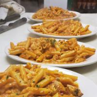Small Penne a la Vodka · Penne pasta served in a creamy pink sauce.