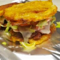 Ala Cubana Jibaritos · Pork, Swiss, pickles, ham with lettuce and tomato and oniona.