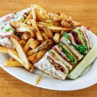 The Denver Club · A triple decker sandwich layered with crisp bacon, sliced lean turkey, lettuce, tomato and m...