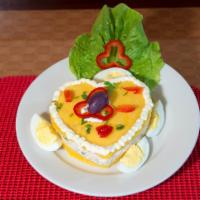 Causa Rellena · Mild spiced smashed potatoes with chicken or tuna filling. 