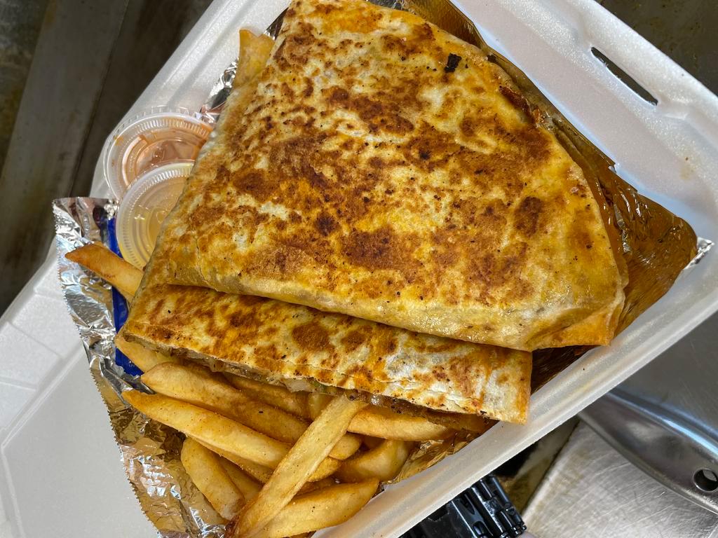 Cheesesteak quesadilla (Combo)  · Cheese steak grilled with onions, Bell pepper, mushrooms and melted Swiss cheese served in 9” White flour tortilla with side of French fries and dipping sauce