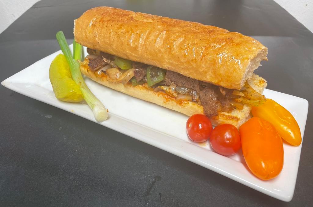 Philly cheese steak (sandwich) · Philly cheese steak sandwich served with Grilled onion, bell peppers ,mushrooms and Swiss cheese