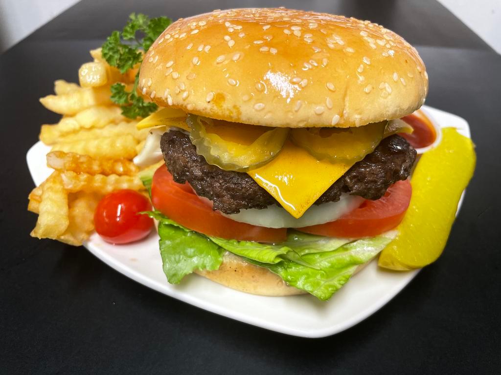Cheese Burger with fries (Combo) · 1/4 burger patties with Letttuce, tomatoes,Pickles ,onion and cheese with side of French fries 