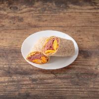 Grilled Steak Wrap · Crispy onions, cheddar cheese, tomatoes and lettuce with chipotle aioli in a sun-dried tomat...