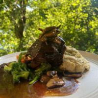 Braised Short Ribs · Mashed potatoes, mushrooms, vegetables with a veal jus.