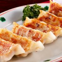 Pan Fried Gyoza Dumplings(7pcs)  煎鸡肉饺 · Dumpling with a minced filling. 